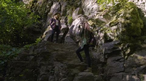 Hiker Poses On A Cliff For Her Friend's Photos, She Shows Off Her Muscles Stock Footage
