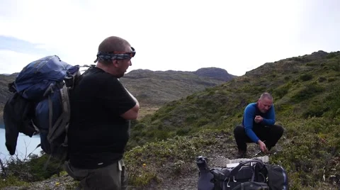 Hiker is puting on his backpack. Patagonia (editorial) Stock Footage 58763771