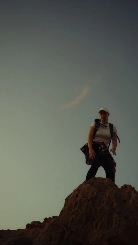 Hiker reaching the rocky summit, successful woman climber celebrating victo.. Stock Footage 339913229