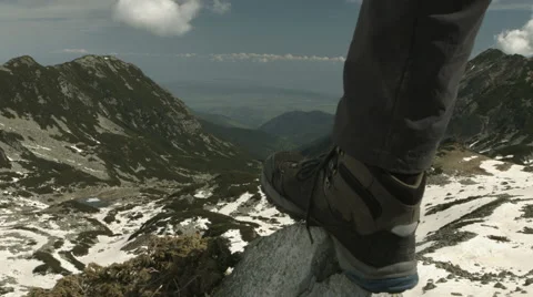 Hiker reaching the summit of the mountain. Blackmagic 4k camera Stock Footage 64350985