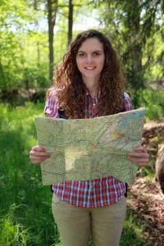 Hiker is reading a map Stock Photos