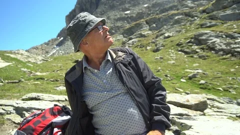 Hiker Resting in Mountains - Model Released Stock Footage 93339972