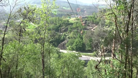 Hiker Saying Goodbye While Riding Zip Line - 43 Stock Footage 308401619