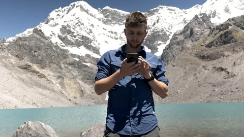 Hiker Sending A Text Message in the Peruvian Andes, Ausangate Stock Footage 125280535