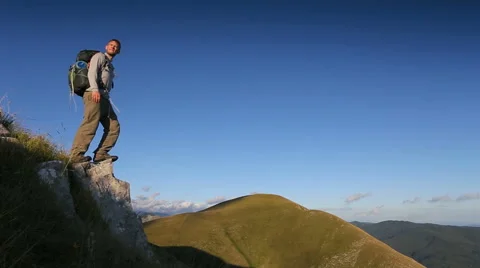 Hiker standing on a cliff Stock Footage 45456138
