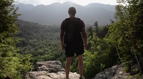 Hiker Standing on Cliff Video stock 50088296