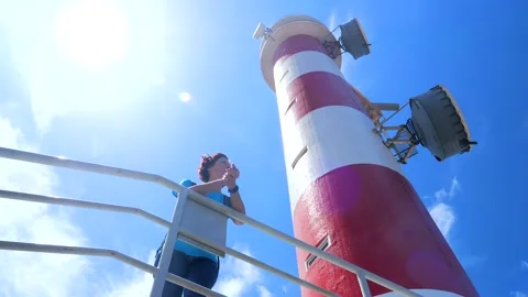 A hiker standing at the Lighthouse of Punta de La Rasca, Tenerife Stock Footage 204893691