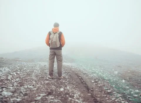 Hiker standing on road Stock Photos