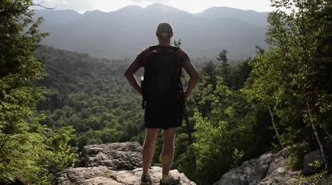 Hiker Stands On Top Of Mountain Video stock 50087939