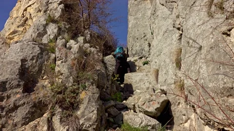 Hiker on the steep scree terrain to the summit of the mountain Stock-Footage 224064515