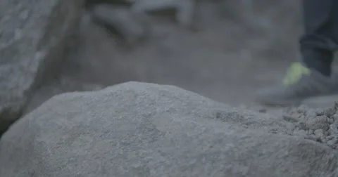 Hiker stepping on rocks Stock Footage 65136222