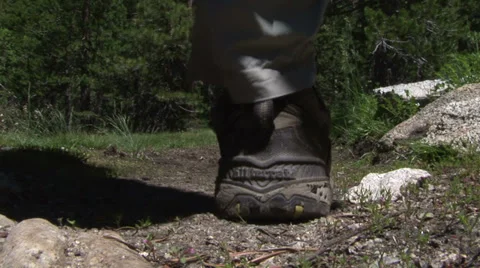 Hiker Steps Over Camera on trail Stock Footage 36176077