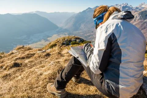Hiker studying a map. Stock Photos