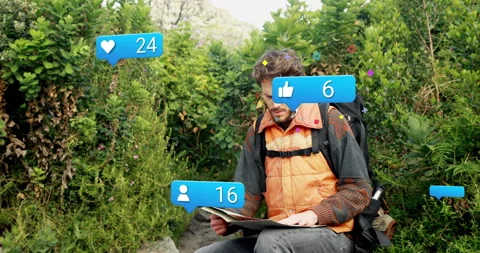 Hiker studying paper map in forest, displaying marketing UI icons with likes Vídeos de archivo 308186030