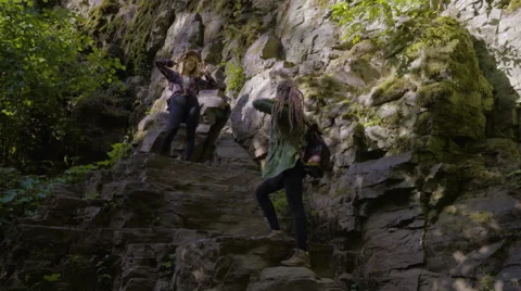 Hiker Takes Photos Of Her Friend Posing On A Cliff In The Mountains Stock Footage