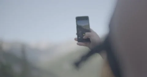 Hiker taking iPhone pic Stock Footage 65183921