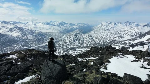 Hiker taking in the View, Epic Mountains in Alaska's remote wilderness Stock Footage 289555879