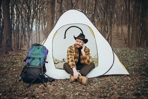 Hiker talking on mobile Stock Photos