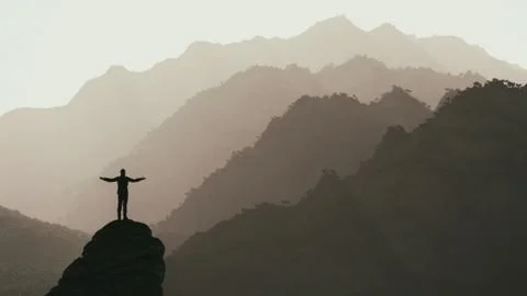 Hiker on the top of a mountain Stock Illustration