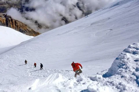 Hiker at the top of a pass Stock Photos