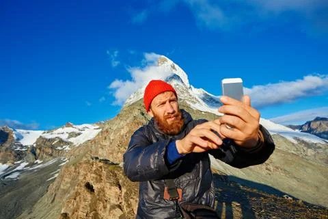 Hiker at the top of a pass Stock Photos