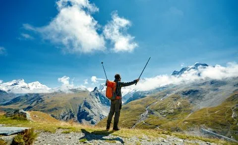 Hiker at the top of a pass Stock Photos