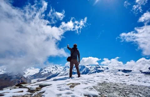 Hiker at the top of a pass Stock Photos