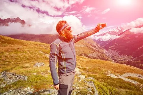 Hiker at the top of a pass Stock Photos