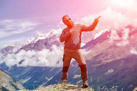 Hiker at the top of a pass Stock Photos
