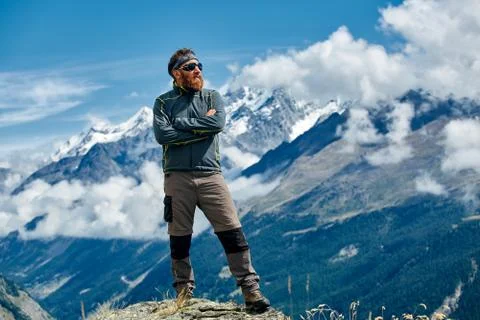 Hiker at the top of a pass Stock Photos