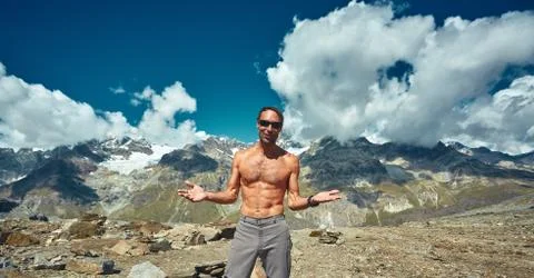 Hiker at the top of a pass Stock Photos