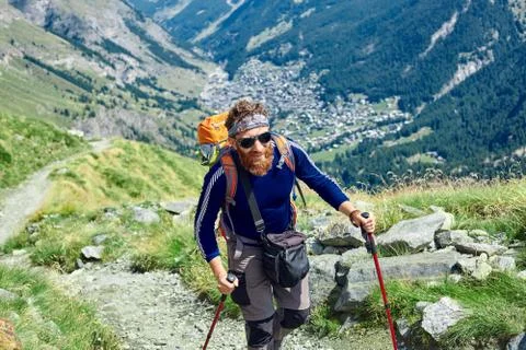 Hiker at the top of a pass Stock Photos
