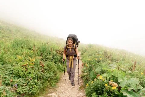 Hiker on the trail with a backpack Stock Photos