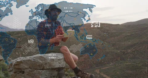 Hiker unfolding paper map while generating animated data network overlay for Stock Footage 315894075