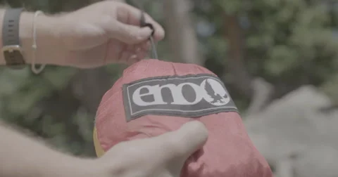 Hiker unpacking hammock Stock Footage 65154852