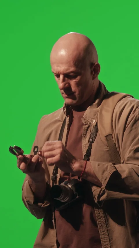 Hiker Using Compass for Navigation against Green Chroma Key Background Stock Footage 269127571