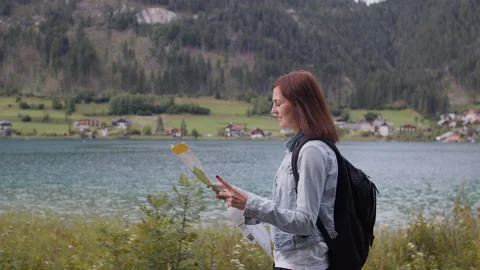 Hiker using a paper map in Austria Stock Footage 130493443