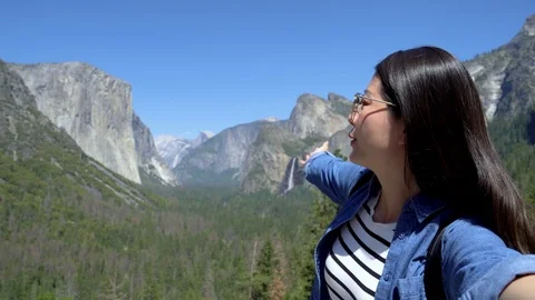 Hiker using phone while trekking outdoors Video stock 118489937