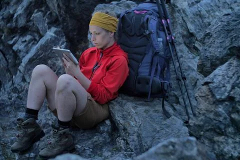 Hiker using portable tablet technology Stock Photos