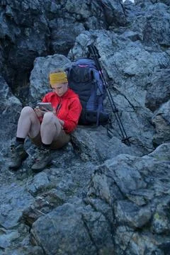 Hiker using portable tablet technology Stock Photos