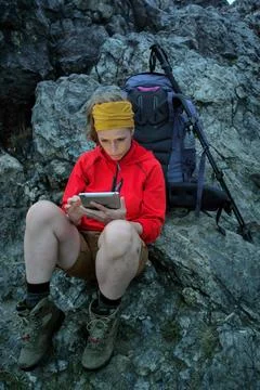Hiker using portable tablet technology Stock Photos