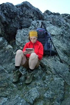 Hiker using portable tablet technology Stock Photos