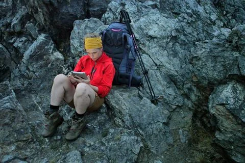 Hiker using portable tablet technology Stock Photos