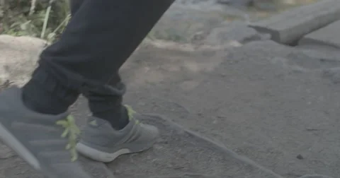 Hiker walking across bridge Stock Footage 65150689