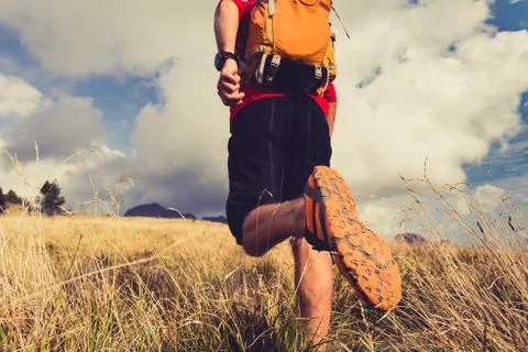 Hiker walking with backpack Stock Photos