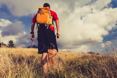 Hiker walking with backpack Stock-Fotos