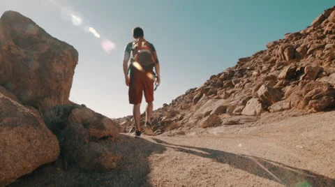 Hiker Walking in Desert away from Camera (Jib Shot) Stock-Footage 49196203