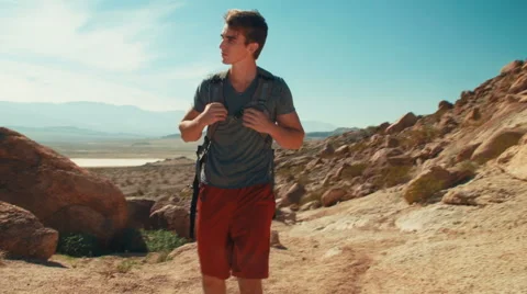 Hiker Walking in Desert Toward Camera Stock-Footage 48784604