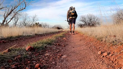 Hiker Walking on Dirt Road Stock Footage 240963204