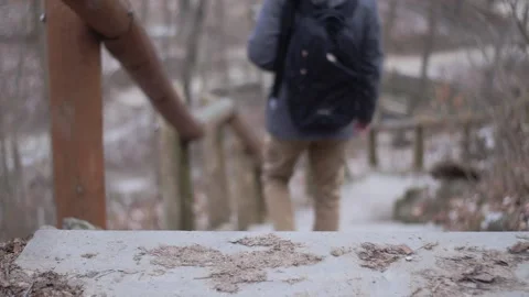 Hiker walking down the stairs Stock Footage 230586186